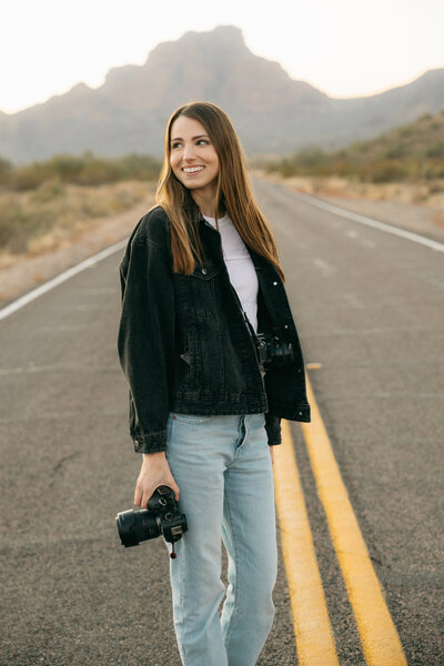 A woman in a denim outfit, shot with a film photography portrait style.