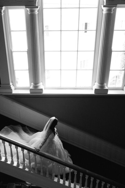 A black and white wedding video of a bride walking down the