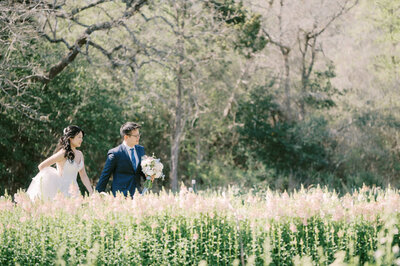 groom rubbing his eye while reading vows during private first look at austin wedding venue the wildflower center