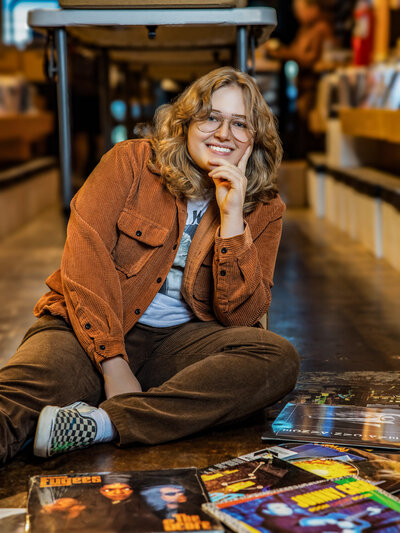 a senior portrait taken in a record shop