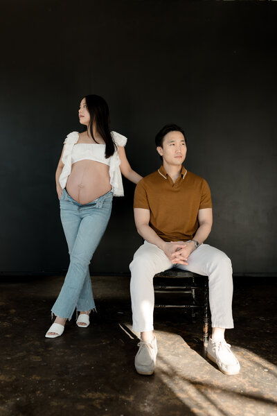 Pregnant woman and husband posing together