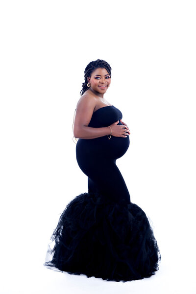 mommy to be in black evening gown showing off her bump