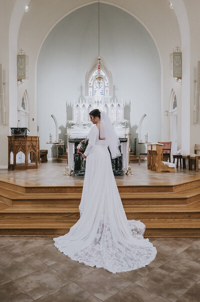 bride standing near the church altar