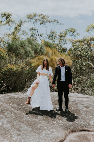 Elopement Photographer in Sydney, the Central Coast and Southern highlands. The photograph is taken at at Elephant Rock on the Central Coast of NSW of a couple celebrating the fun outdoor adventure elopement wedding