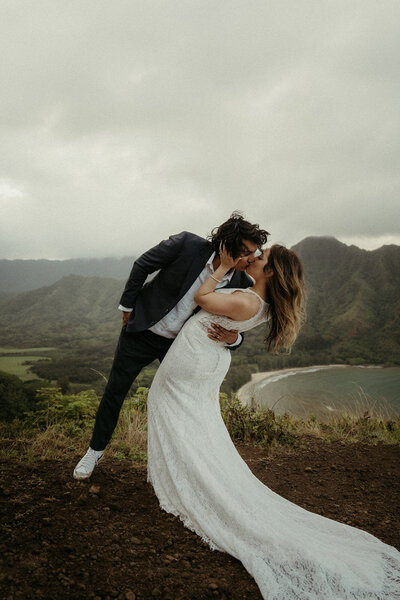 husband and wife holding cameras