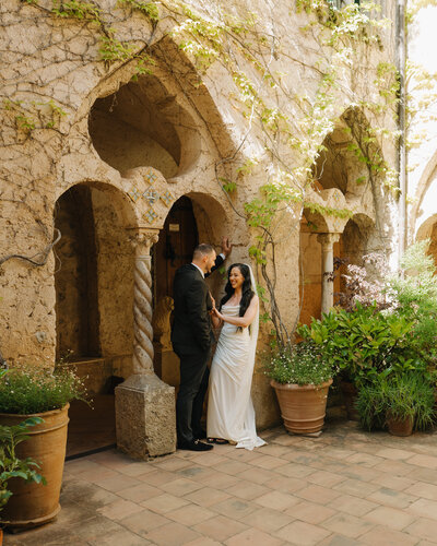 bride and groom on bridge in the redwoods