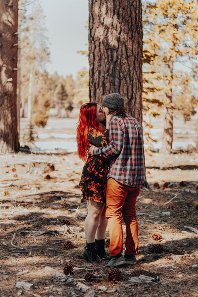 Couple kisses after she says yes in Lake Tahoe, California.