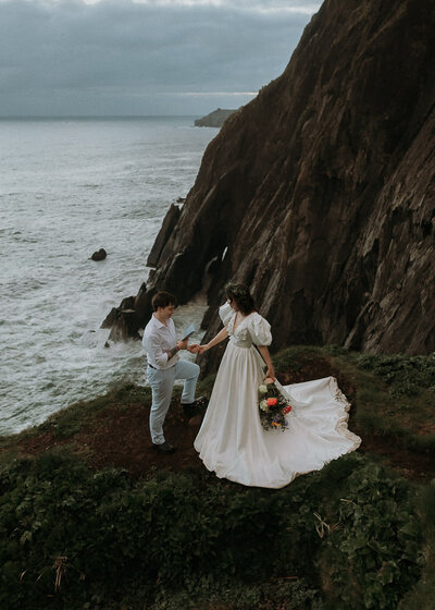 An LGBTQ+ couple having their wedding ceremony at Elk Flats Trail in Oswald West State Park, Oregon.