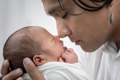 Edmonds newborn photographer, Thistle and Bloom Photography, captures special moment between father and newborn son.