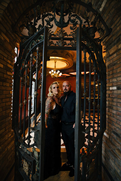 Silhouette of two men kissing with the blue sky and ocean behind them at their Micro Wedding
