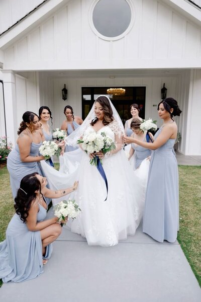 bridesmaids getting bride ready for wedding at atlanta wedding venue