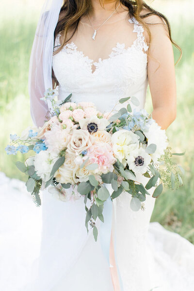Gorgeous and classic wedding bouquet by Flower Aura By Natasha, classic Calgary, Alberta wedding florist, featured on the Brontë Bride Vendor Guide.
