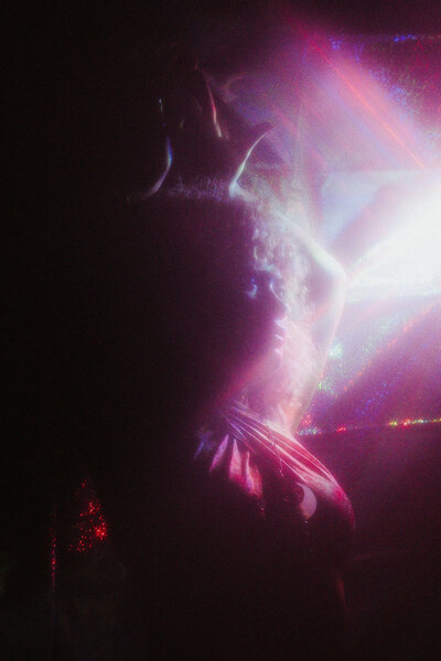 A girl bathes in a moon beam.