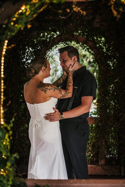 Bride and groom sharing a candid moment during their ceremony in Nashville.