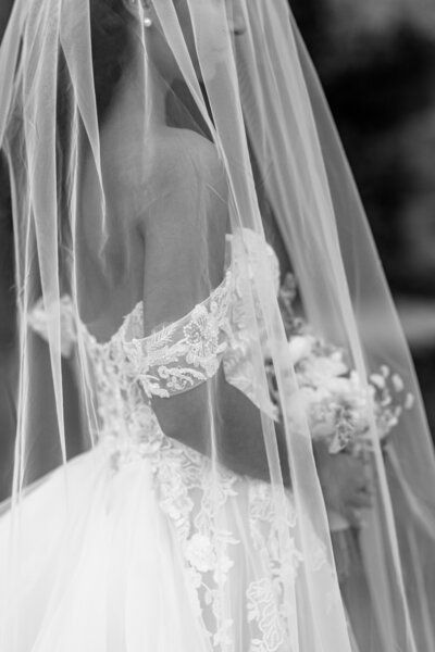 Atlanta Photographer Bridal Portraits | Black and white close-up photo of a bride's off-the-shoulder detail wedding gown