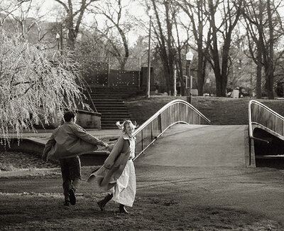 Couple Running at Allegheny Commons Park during Engagement