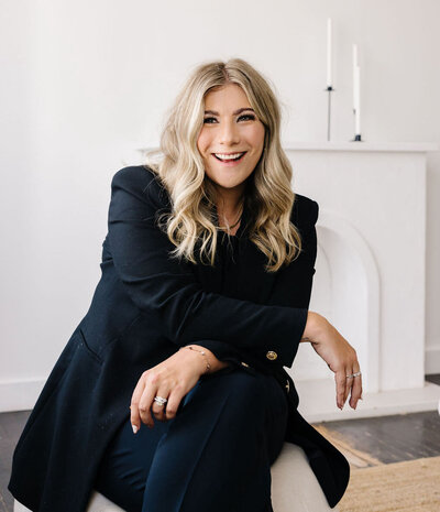 Calgary Realtor Leigh Kormos in black coat