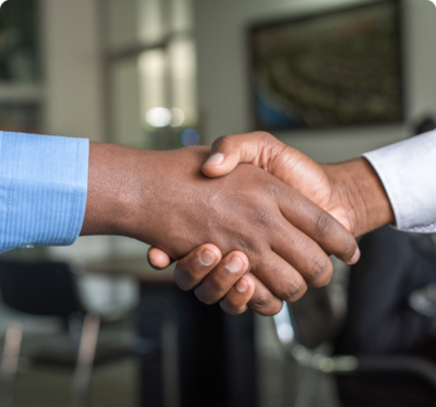 A handshake image, symbolizing the partnership and support from donors who contribute to the Center for Leadership Excellence and its mission to develop diverse leaders in the real estate industry.