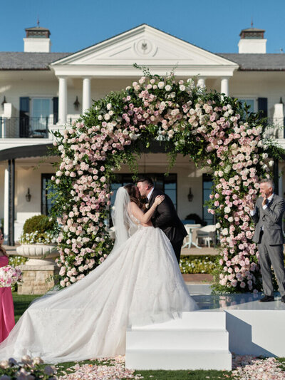 Bride and groom walk up memorial steps at their DC wedding