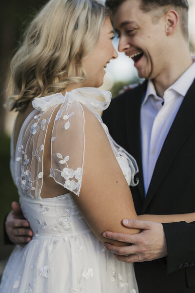 wedding rings, stationery, a perfume bottle, and bridal shoes