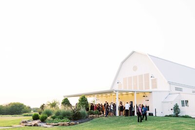 guests enjoying cocktail hour at outdoor TX wedding