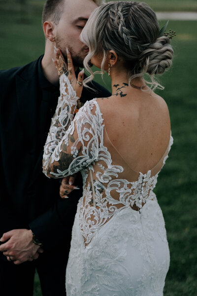 Bride featuring a low bun with braided detail — romantic and textured bridal hairstyle by Klover Beauty in Maryland.