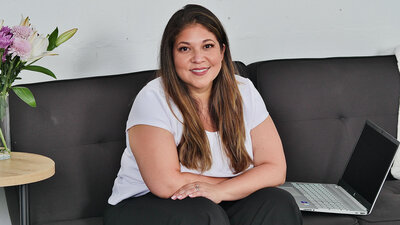 Professional headshot photo of Teresa Cordoba wearing a white blouse.