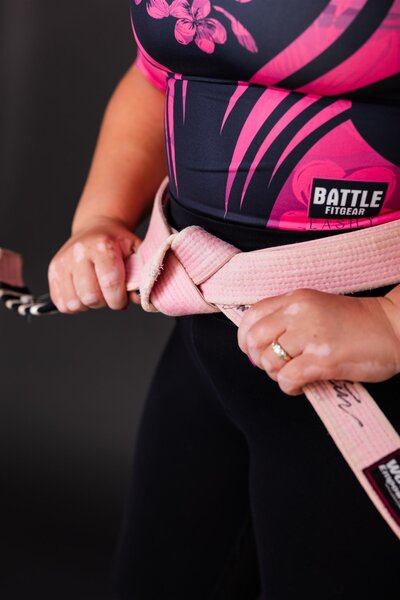 Close up of a jiu jitsu pink belt