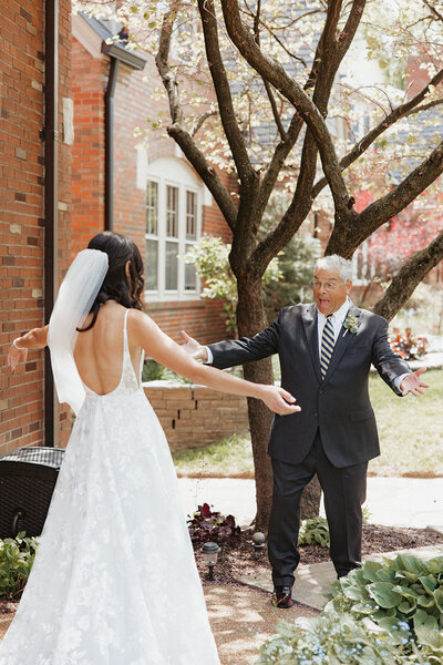 Father of the bride is excited, seeing his daughter before the wedding, taken by wedding photographer Jacoby Andrick