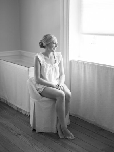 Bride smiles as she gets ready for her wedding