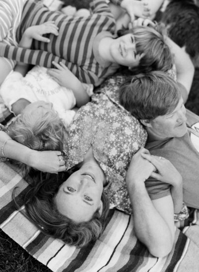 black and white portrait of colorado mom holiding kids and husband