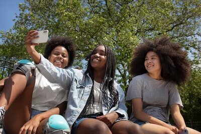 girls smiling for selfie