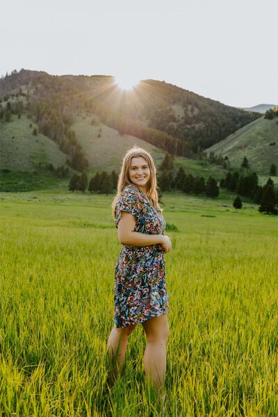 Meredith stands in Big Sky, Montana for her senior photos.