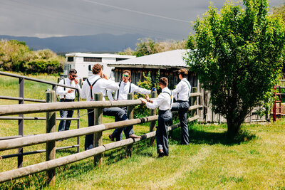 Groomsmen smoking cigars at Staubach Creek Ranch in Winston, MT