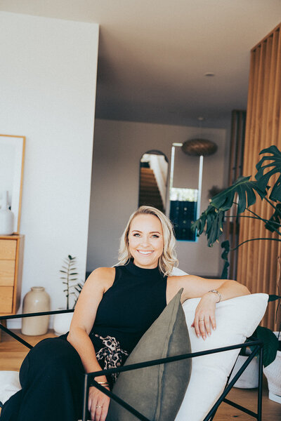 Personal brand image of confident blonde female in luxury home
