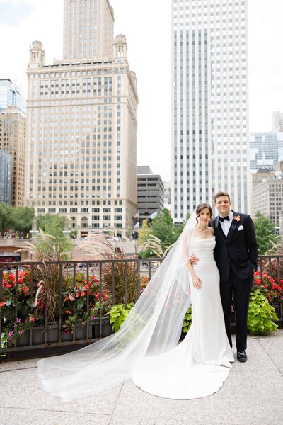 Elegant black and white wedding portrait of bride and groom outside of St. James Chapel in Chicago