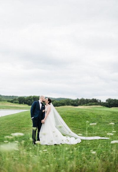 bride and groom kissing