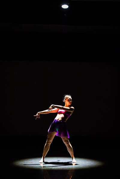 Girls in vibrant dance attire on stage