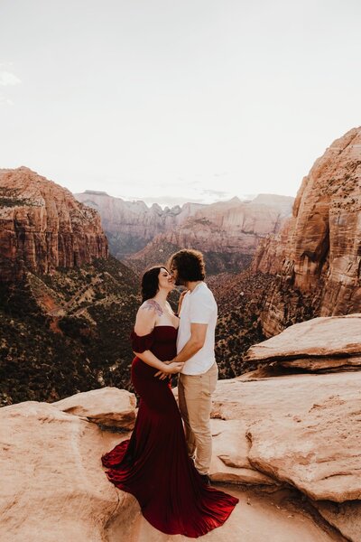 mom wearing red dress in phoenix maternity session