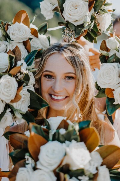 a bride surrounded by flowers at rumbling bald at lake lure