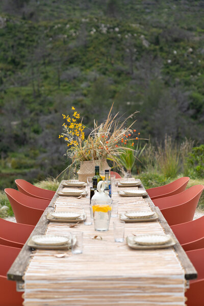 Dining al fresco at the the terrace of B&B in L'Atzubia Spain and view on the rolling hills.