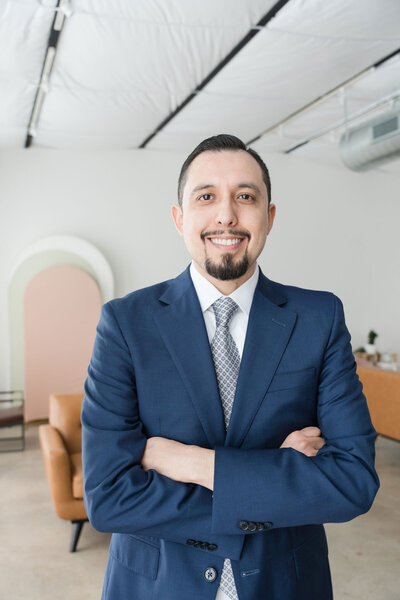 Experienced CPA at Romo CPA Tax + Advisory in Dallas, TX, professionally dressed and specializing in tax services for entrepreneurs and small business owners.