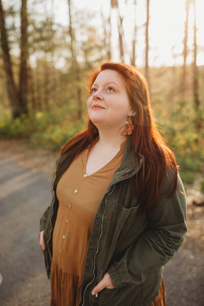 Blacksburg, Virginia Photographer, Melena Lawson, smiles and looks up at the sky hopefully. 