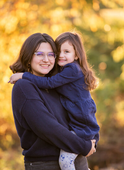 big sister holding little sister
