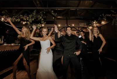 Lively bridal party dance, reflecting LIMCO's dedication to creating fun, inclusive wedding celebrations.