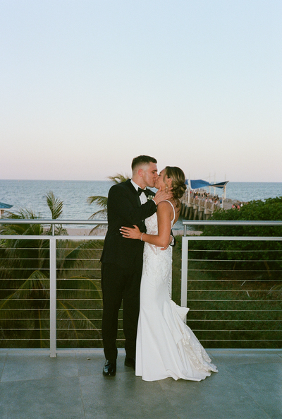 Newlywed's first kiss after vows on the west coast documentary-style photograph | Sush Digital Media