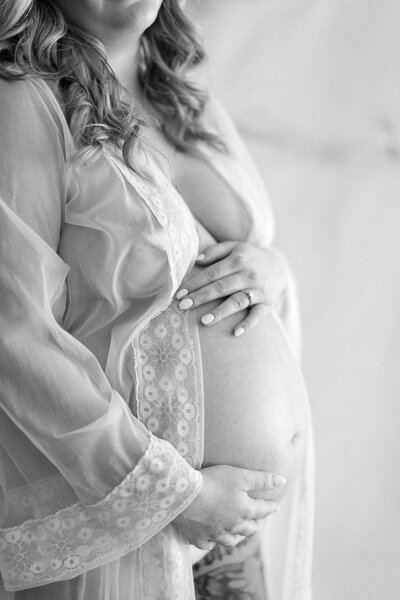 A studio maternity session with husband and wife.