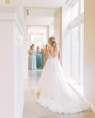 Bride walking towards her bridesmaids