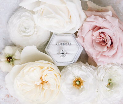 Stunning wedding rings and wedding day florals. Photo provided by Flocal Co.