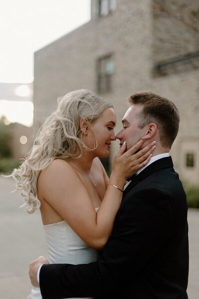 bride and groom about to kiss